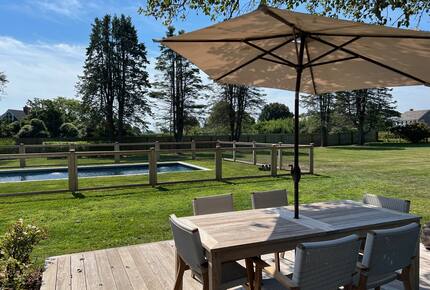 Cottage back deck overlooking pool and farm