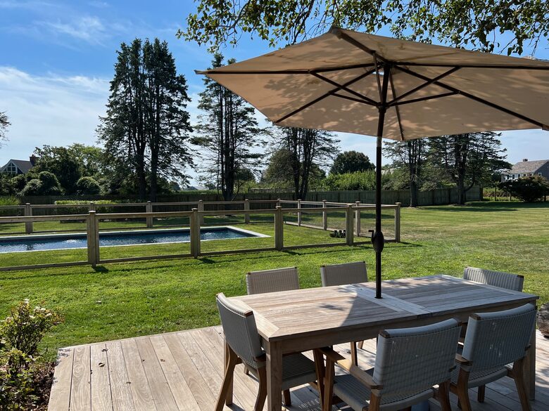 Cottage back deck overlooking pool and farm