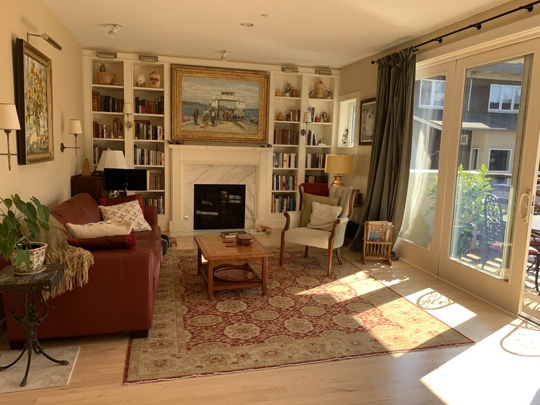 library with fireplace as you walk into the condo