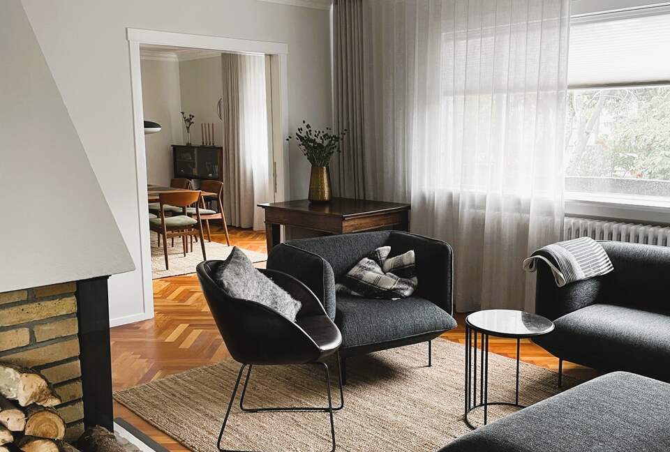 Open living/dining area with a fireplace