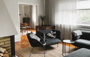 Open living/dining area with a fireplace