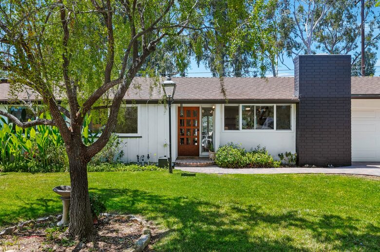 exterior house entry with antique lantern from Scotland