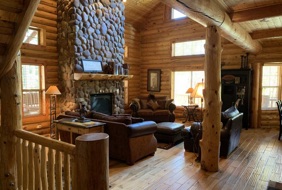 Living area with river rock fireplace