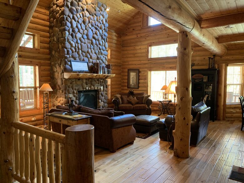 Living area with river rock fireplace