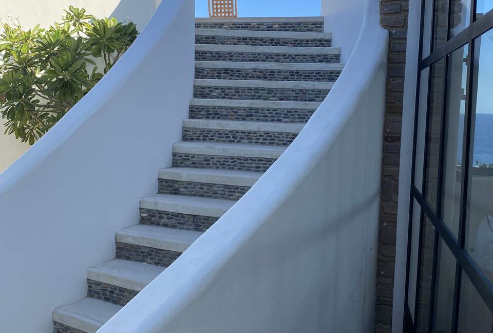 Courtyard staircase up to the roof deck