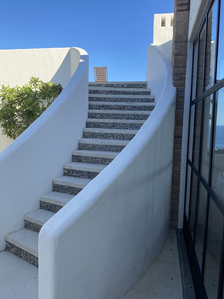 Courtyard staircase up to the roof deck