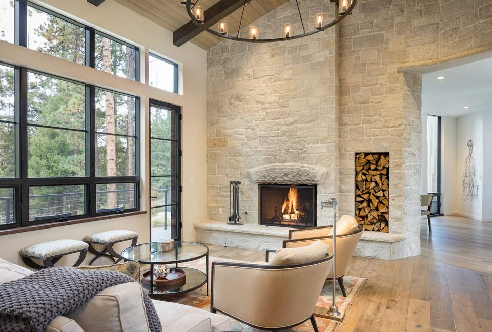 Living room with vaulted ceilings and stone wall fireplace