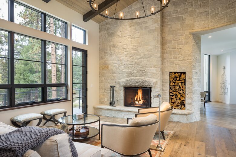Living room with vaulted ceilings and stone wall fireplace