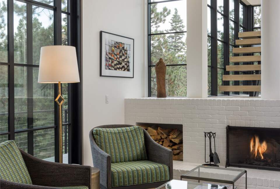 Family Room with fireplace and open stairway.
