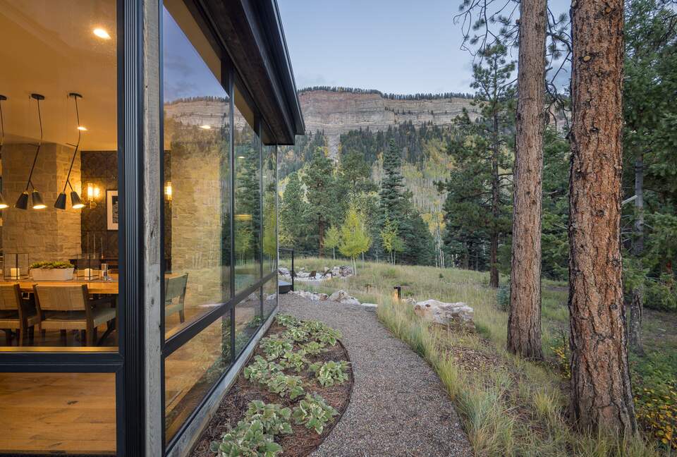 Interior dining room contrasted with Hermosa Cliffs.