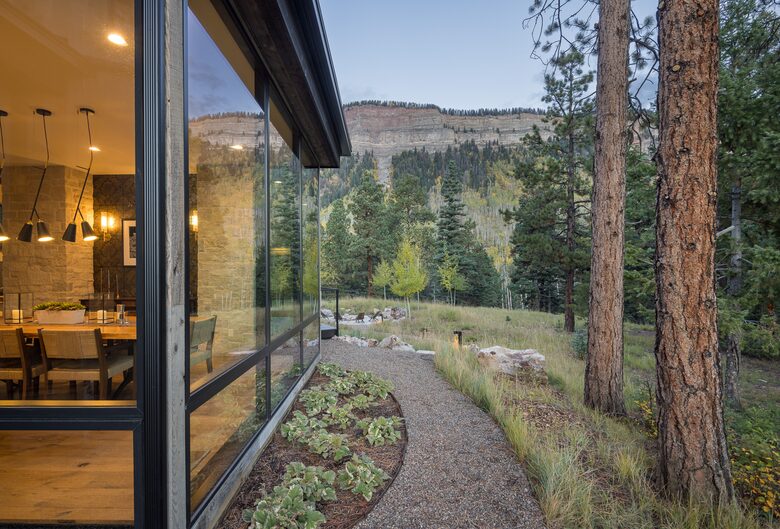 Interior dining room contrasted with Hermosa Cliffs.