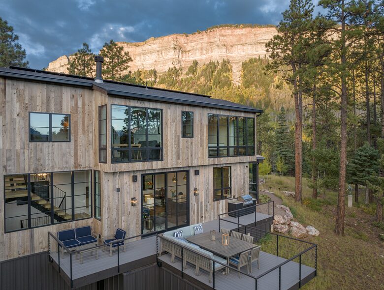 Exterior view of custom Durango Mountain Home and cliffs.