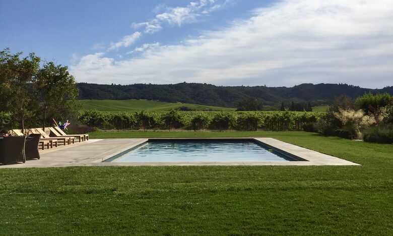 Solar-heated pool surrounded by vineyards