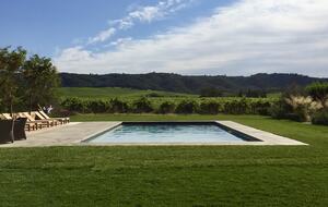 Solar-heated pool surrounded by vineyards