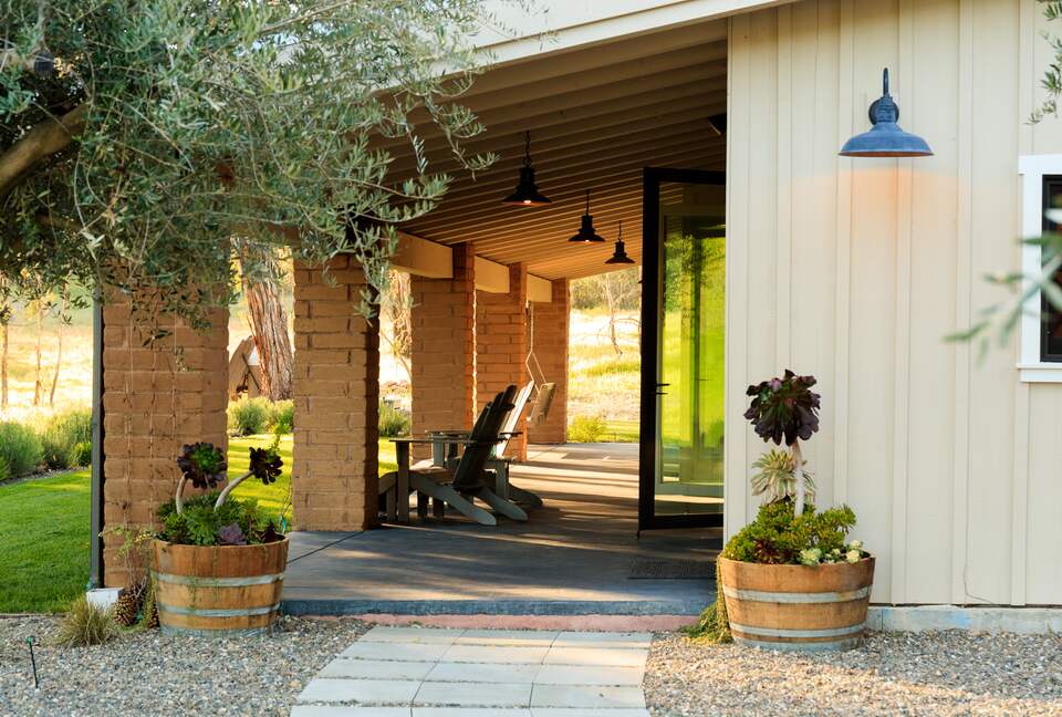 Porch runs the length of the house and faces the mountains.