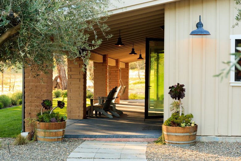 Porch runs the length of the house and faces the mountains.