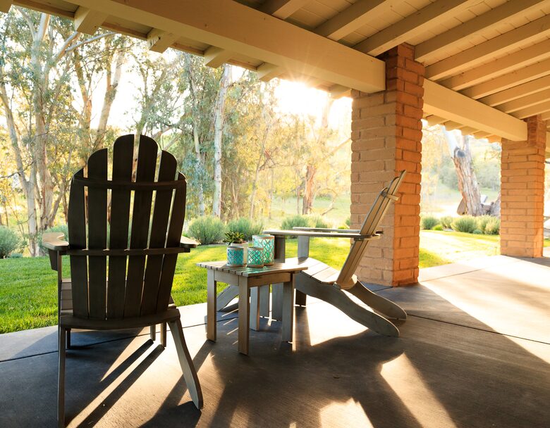 The porch Adirondack chairs are a perfect place to relax.