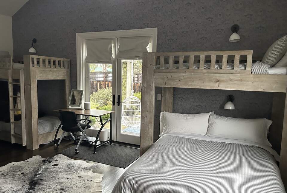 Bunk room with it's own adjoining patio and rose garden.