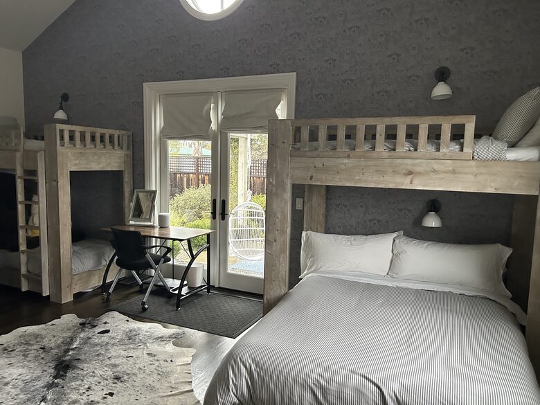 Bunk room with it's own adjoining patio and rose garden.