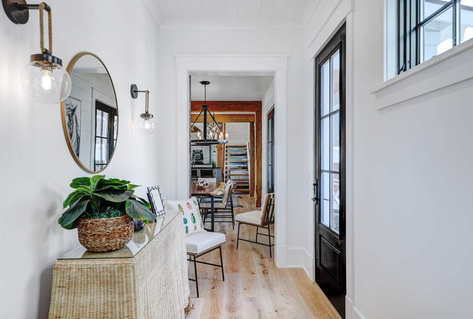 hallway from guest suites to great room, kitchen & dining