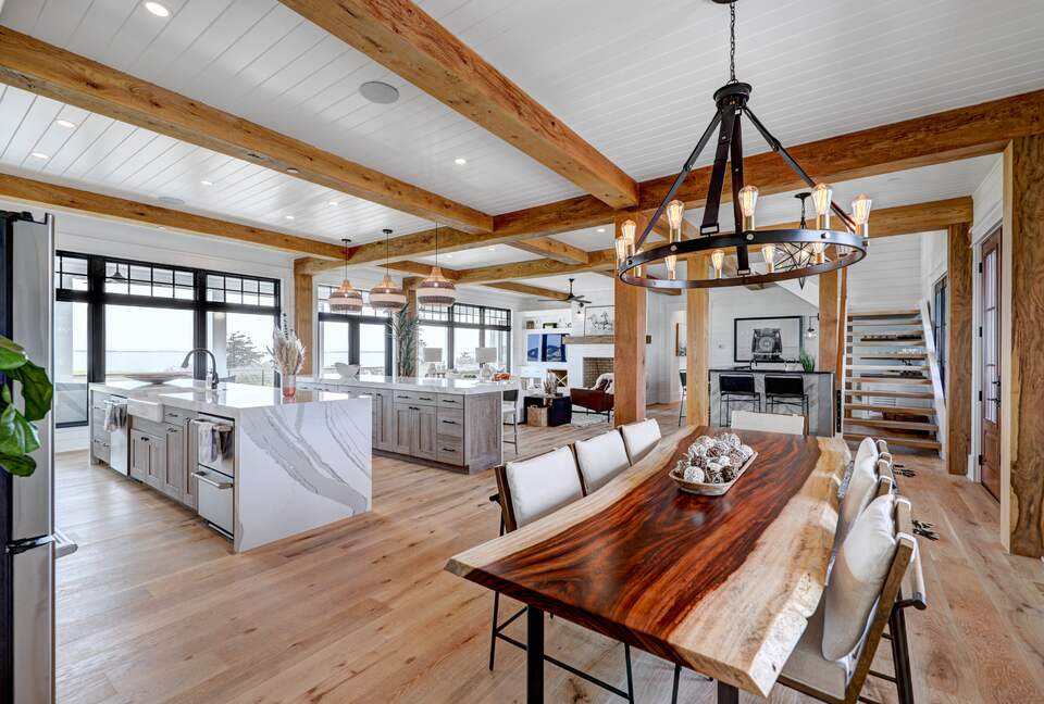 great room showing natural wood dining table in foreground