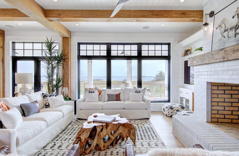 great room with windows out to porch, dock and bay