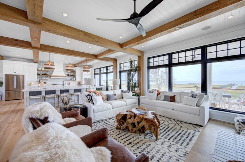 great room with windows out to porch, dock and bay