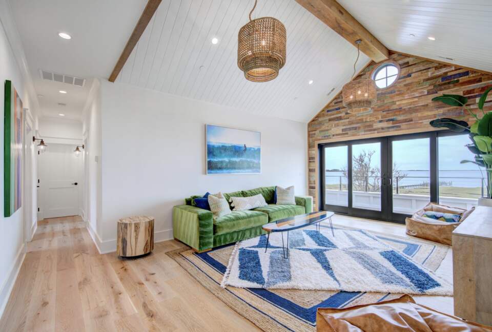 upstairs tv and play room with large balcony