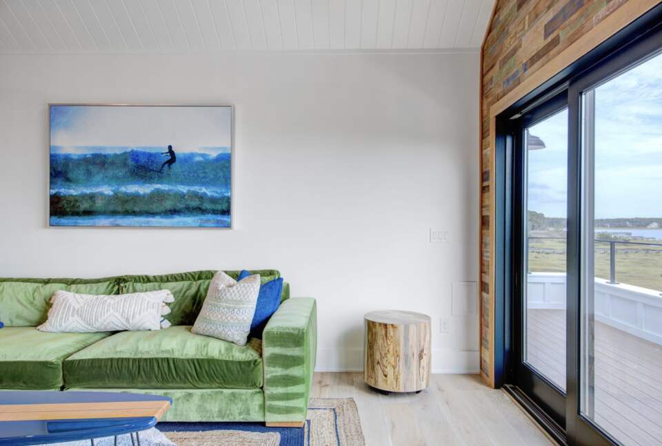 upstairs play and tv room with large balcony