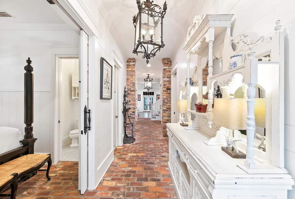 New Orleans inspired brick 'carraige house" entrance.