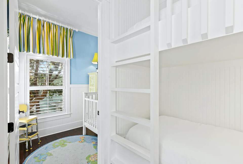 2 bunk beds off 1 K suite, door seperating full crib room.