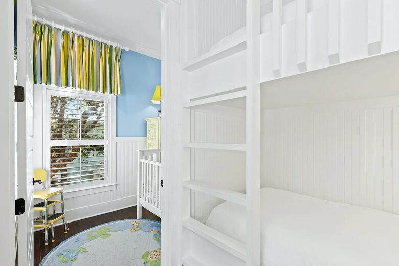 2 bunk beds off 1 K suite, door seperating full crib room.