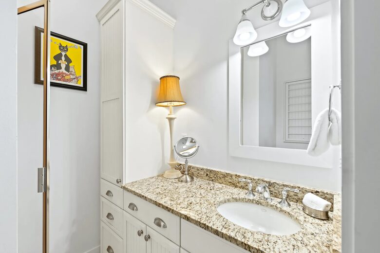 Yellow K suite with shower, vanity and drawers for storage.