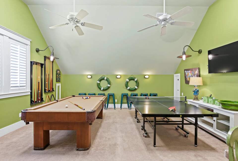 Pool table, ping pong, Tv, 6 person game table.