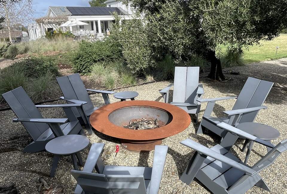 The second fire-pit, adjacent to the bocce and trampoline.