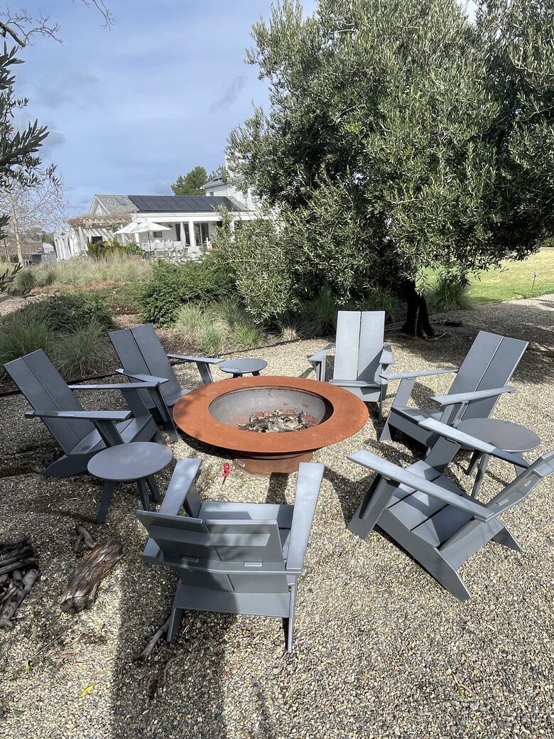 The second fire-pit, adjacent to the bocce and trampoline.