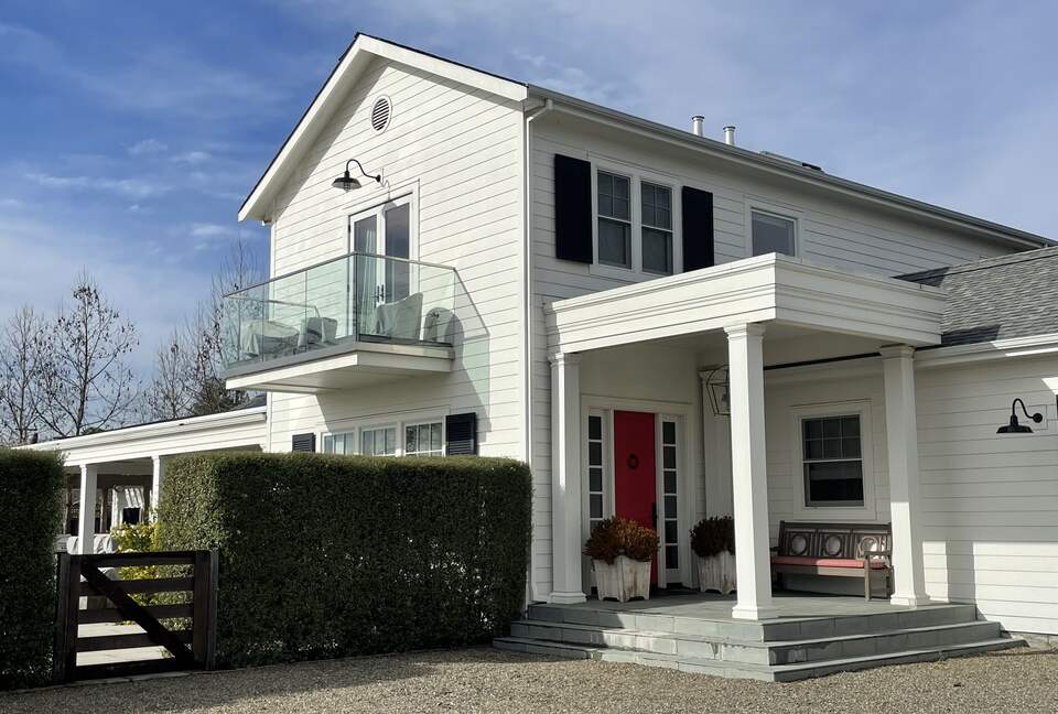 The front porch and deck off of the principal bedroom.