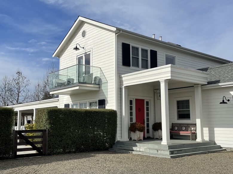 The front porch and deck off of the principal bedroom.
