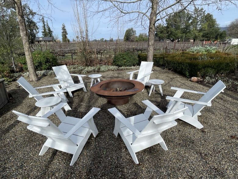 The first of 2 fire-pits, adjacent to outdoor dining table.