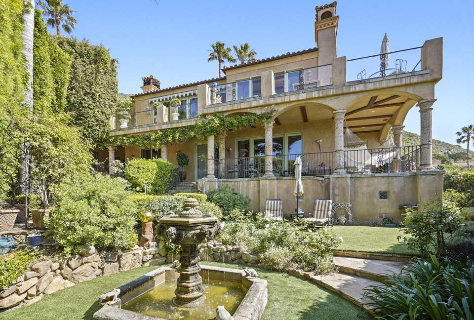 View of Villa, grand fountain and lounges