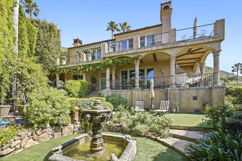 View of Villa, grand fountain and lounges