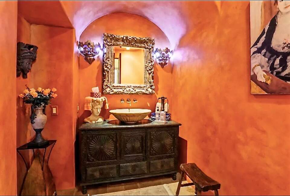 Powder Room handpainted walls, stone sink, & Antiques