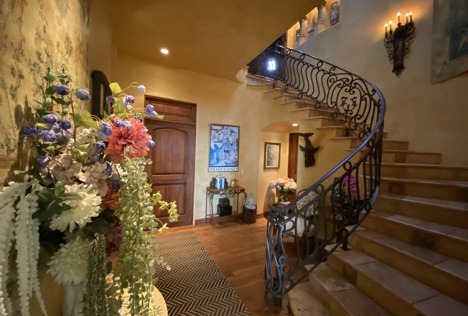 Serpentine Staircase to lower level Bedrooms & Laundry