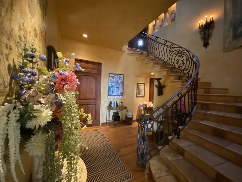 Serpentine Staircase to lower level Bedrooms & Laundry