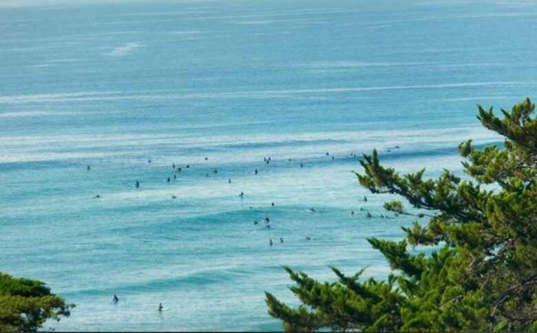 Surfers at our County Line Beach seen from Villa