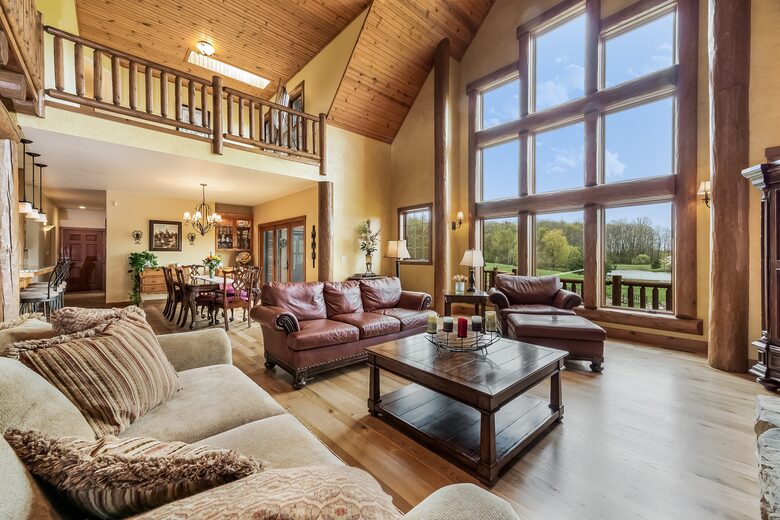Great Room with floor to ceiling log fireplace
