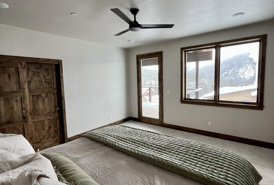 Master bedroom with King bed on middle level with deck access
