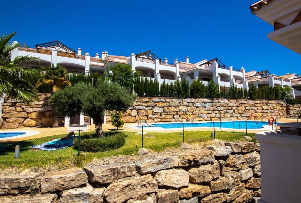 Pool view from the kitchen, patio off kitchen, and third bedroom