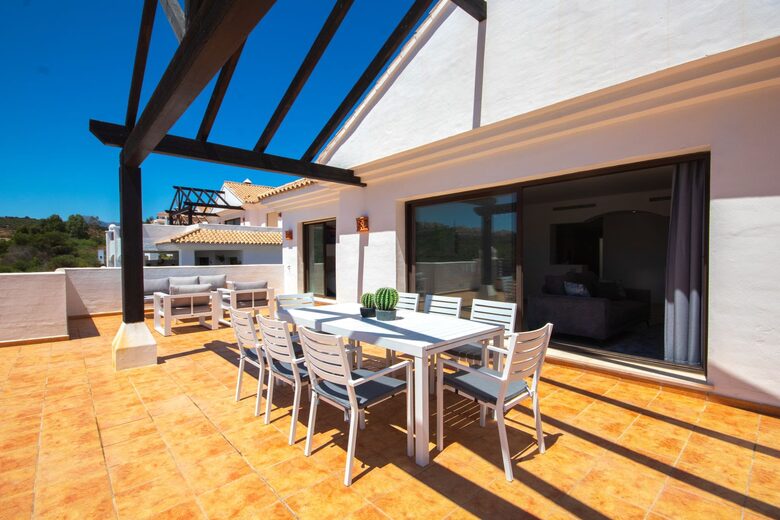 Super-sized patio with lounge set, dining for 8, and chaise chairs.