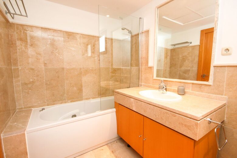 Master bathroom with jacuzzi tub, heated floors, and bidet